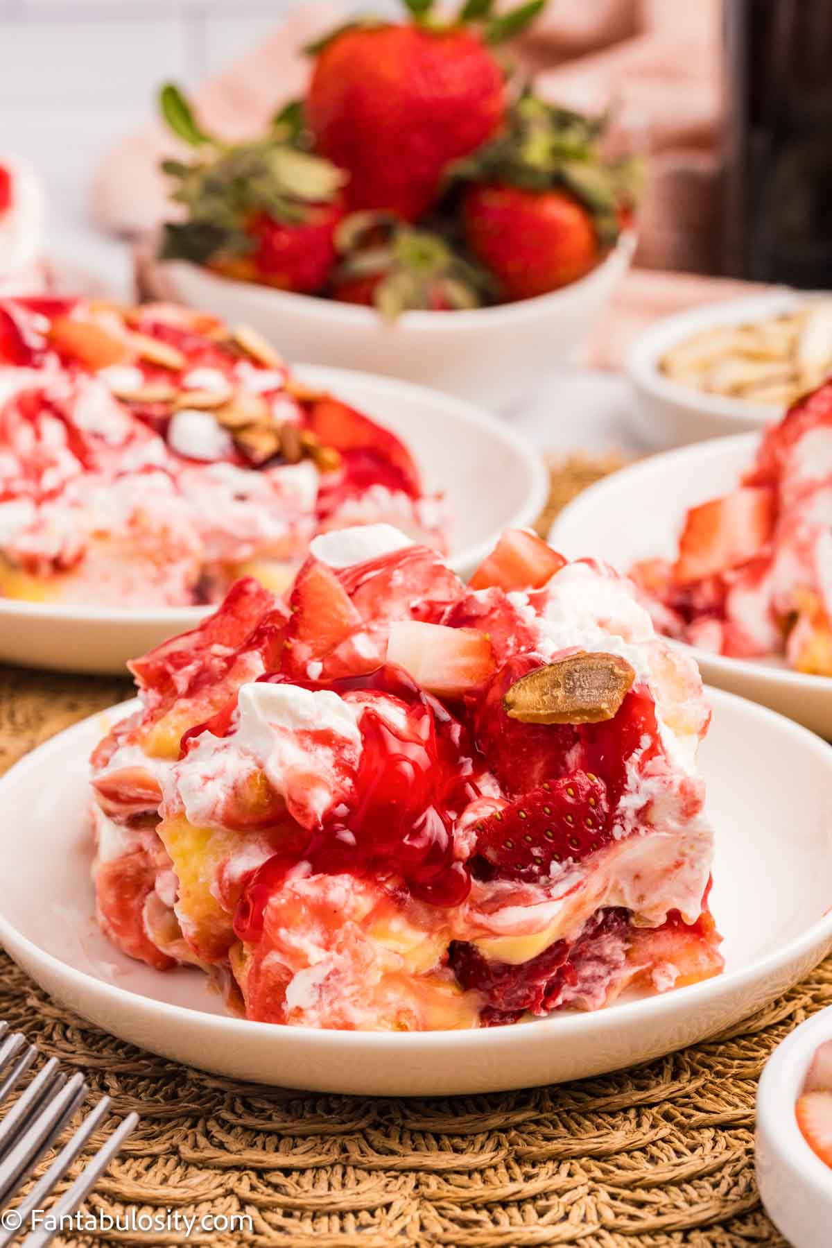 A slice of strawberry heaven cake on a plate.