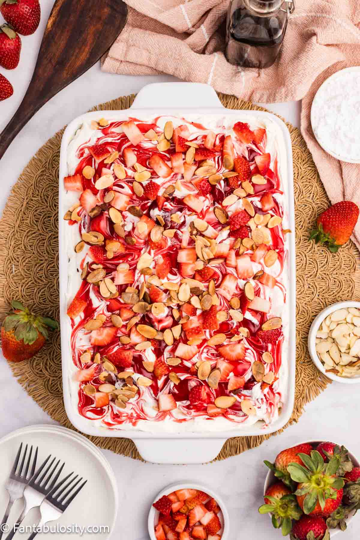 Sliced toasted almonds on top of strawberry heaven.