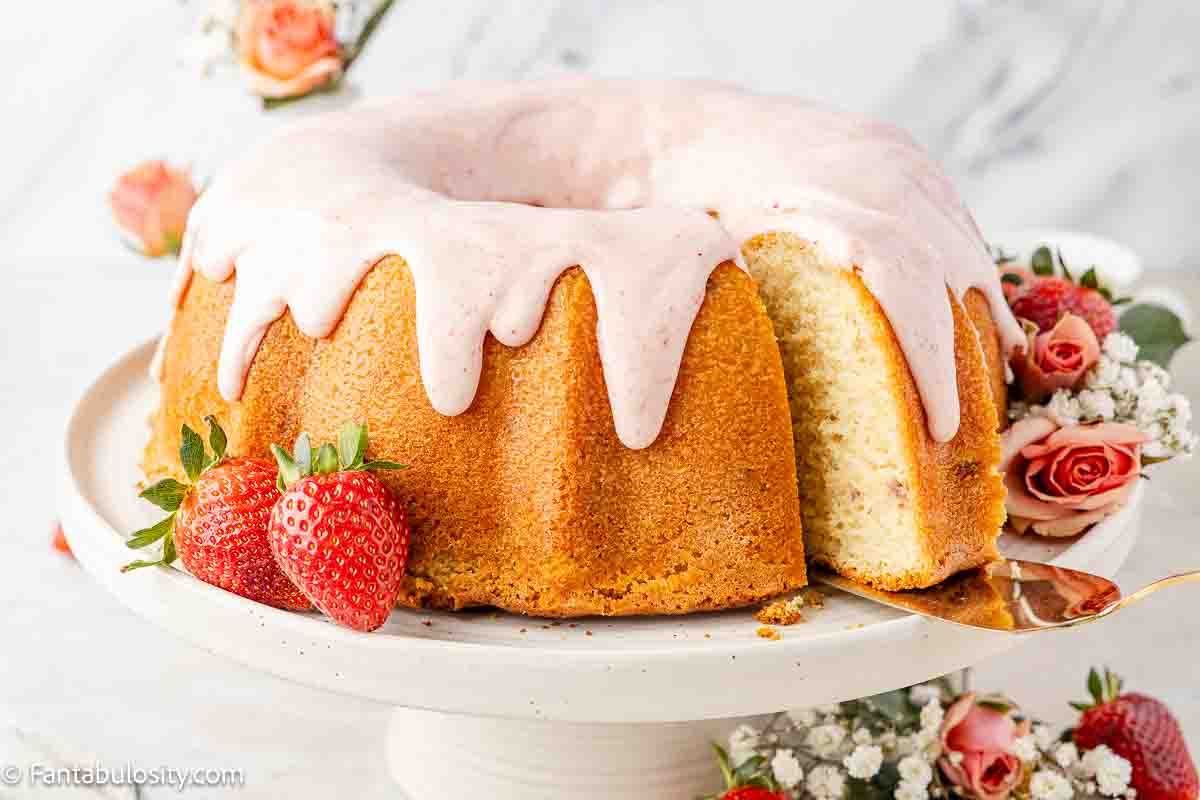 Strawberry pound cake on cake stand.