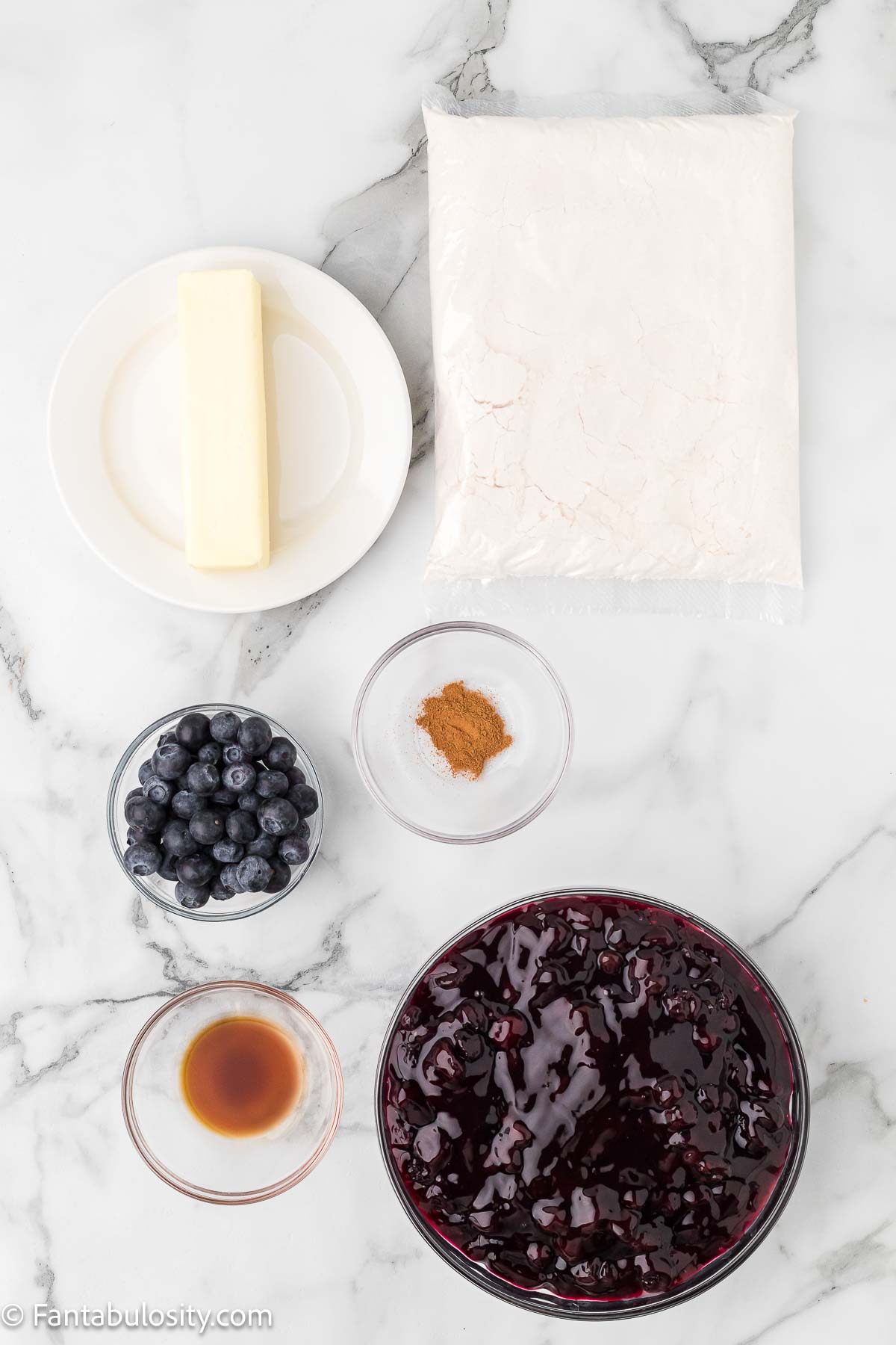 Blueberry dump cake ingredients sitting on kitchen counter. 