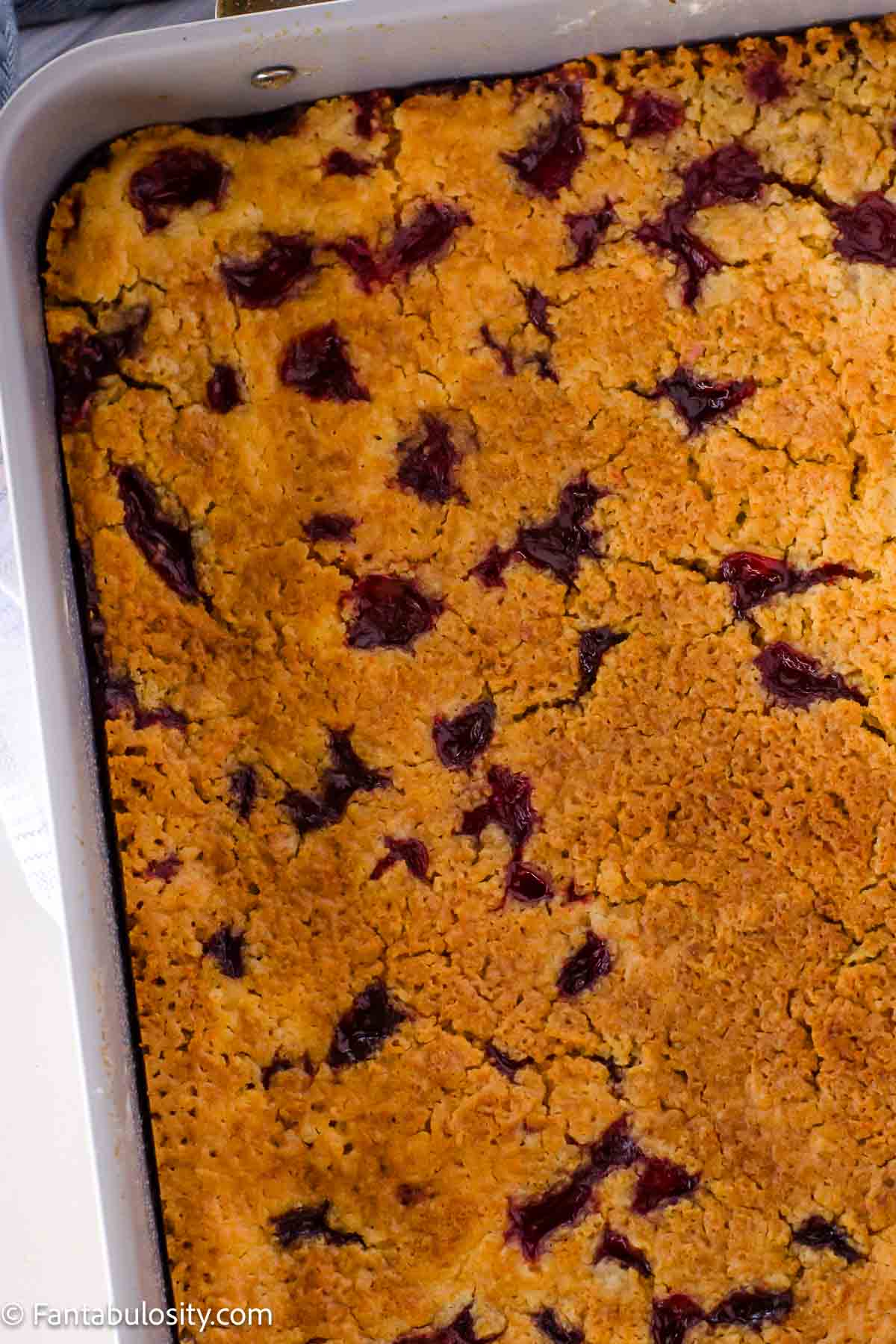 Baked cherry dump cake in a 9x13 baking dish.