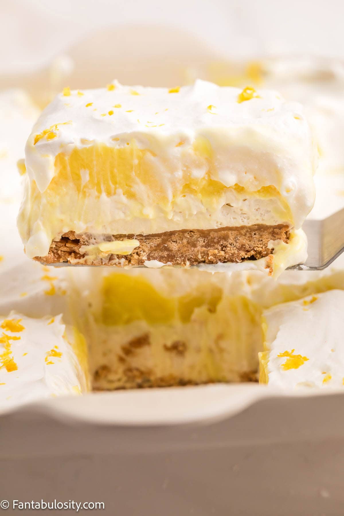 A slice of lemon lush on a spatula.