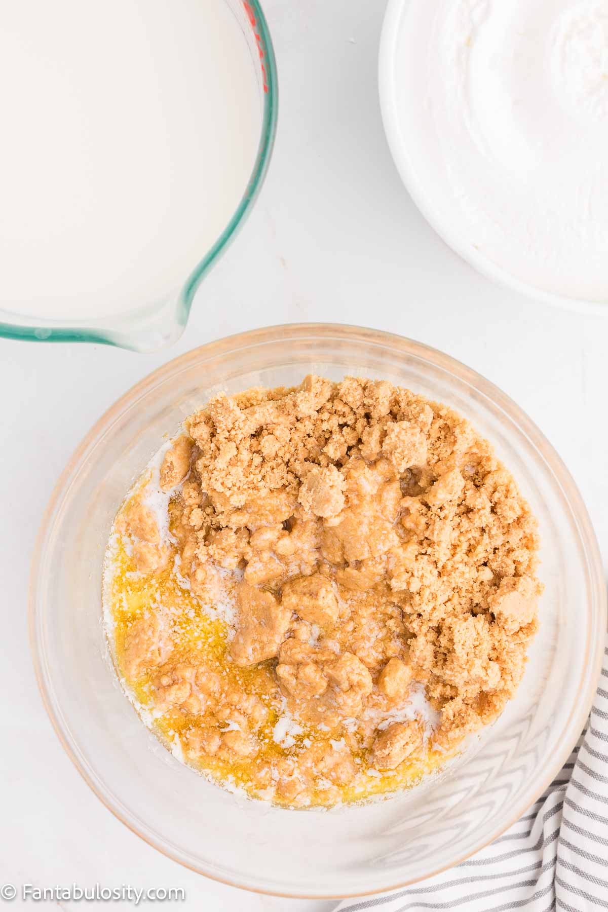 Shortbread cookie crumbs and butter in mixing bowl.
