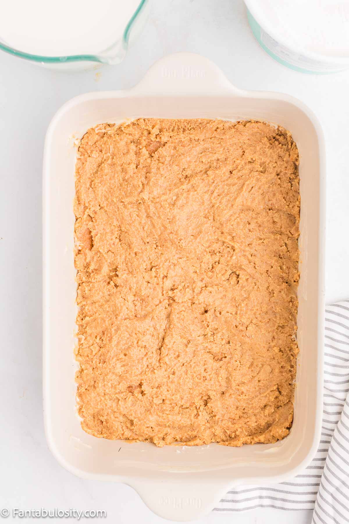 Graham cracker crust pressed in baking pan.