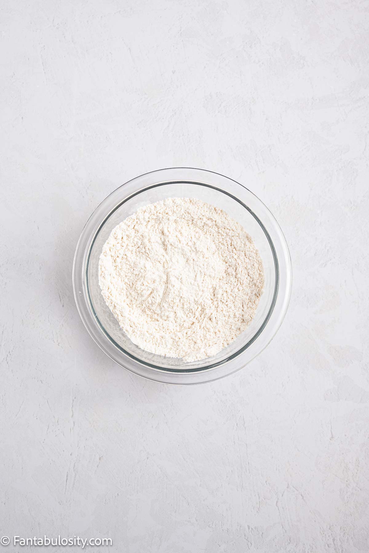 Flour and dry ingredients in mixing bowl.