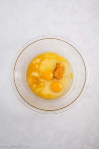 Eggs, sugar and oil in mixing bowl.