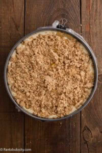Remaining cheesecake batter poured in to spring pan, topped with peaches and topping.
