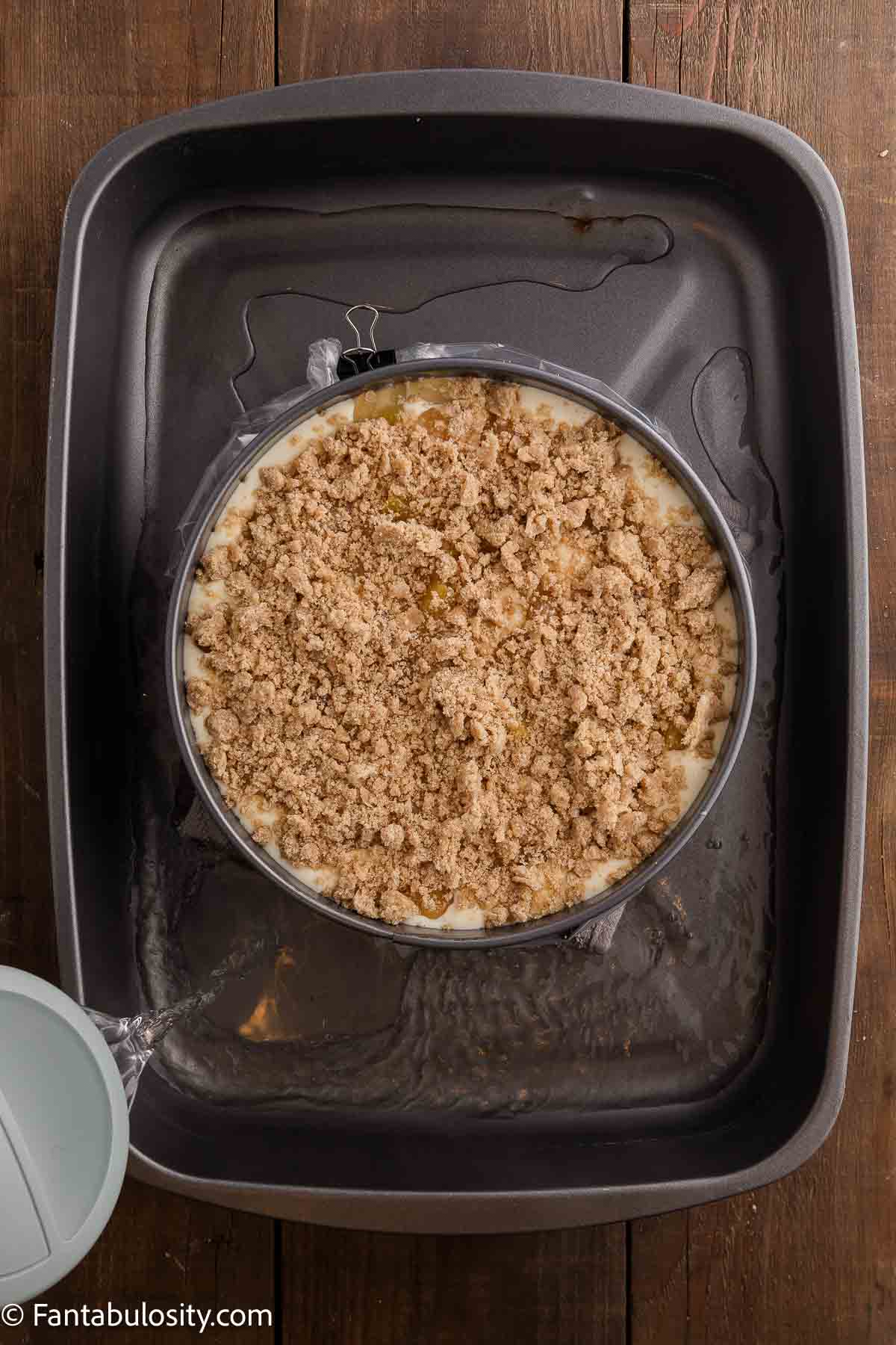 Spring pan sitting in roasting pan, and wrapped.