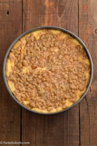 Baked peach cobbler cheesecake in springform pan