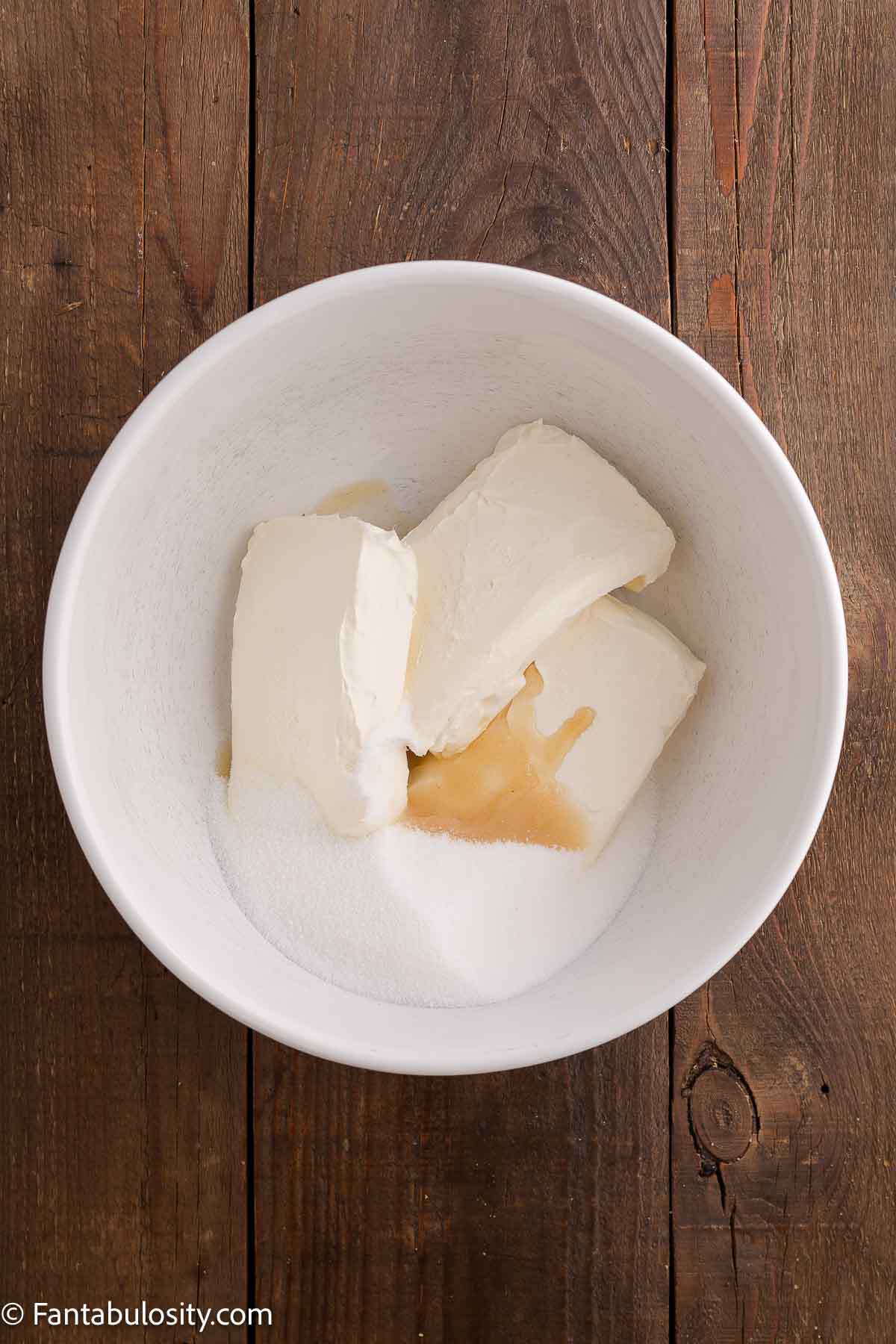 Cream cheese, vanilla, sugar in mixing bowl.