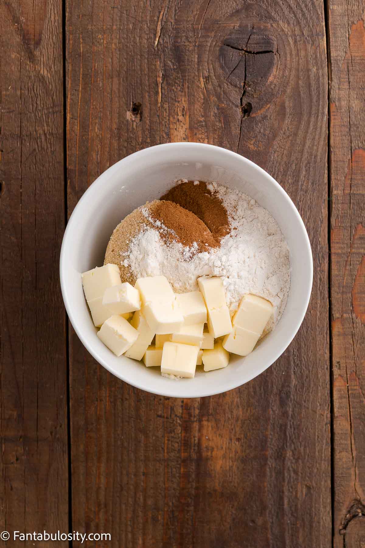 Sugar, cinnamon and butter in mixing bowl for streusel topping.