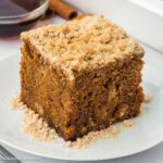A slice of shoofly cake sitting on round plate.