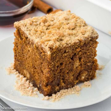 A slice of shoofly cake sitting on round plate.