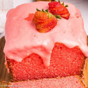 Strawberry Bread loaf with Strawberry Icing, dripping down the side.