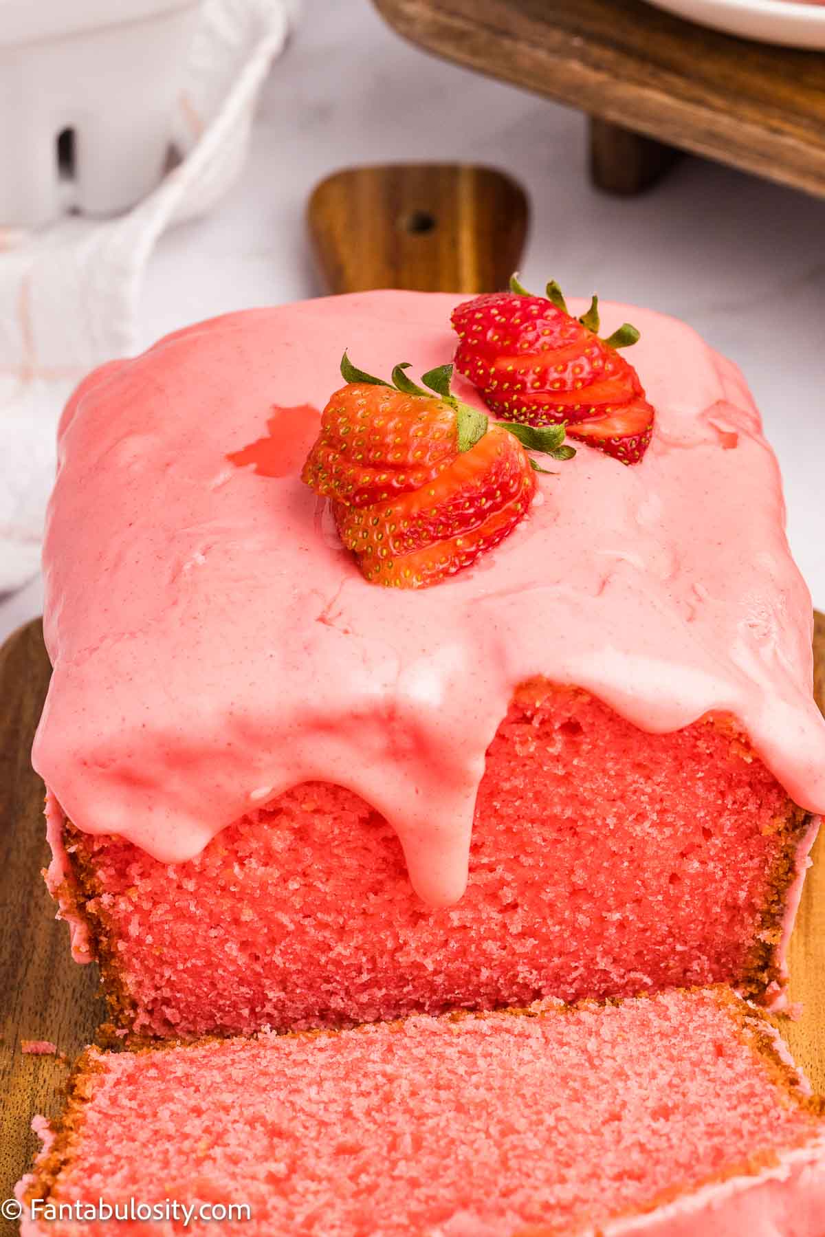 Strawberry bread loaf, with strawberry glaze on the top.