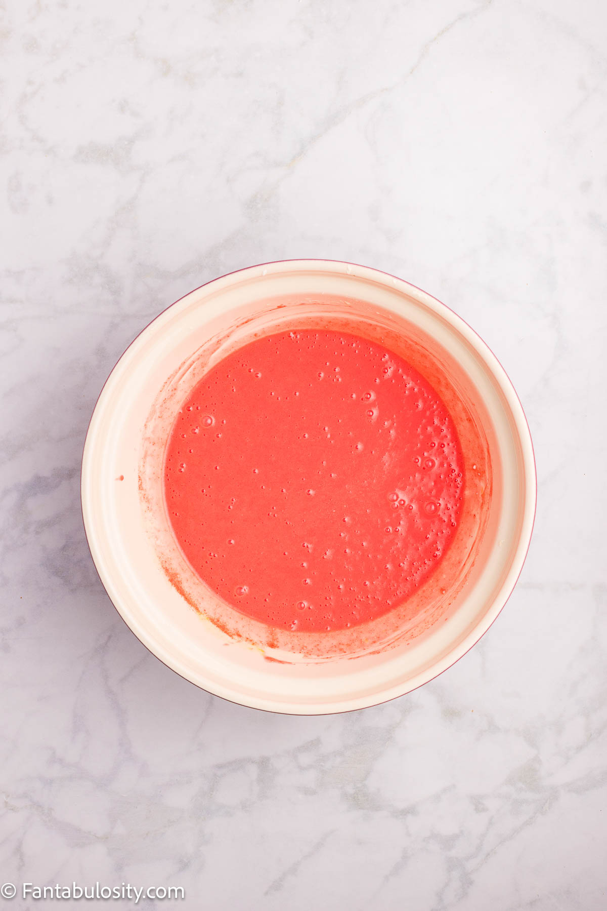 Strawberry jello powder added to strawberry bread batter.