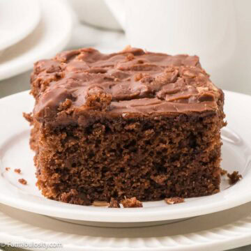 A slice of Westhaven cake on a round plate.