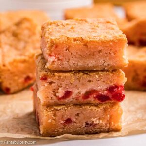 Cherry Blondies stacked on top of one another.