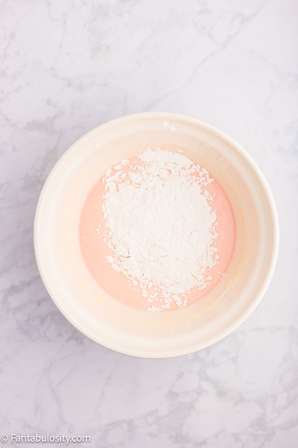 Dry ingredients added to cherry juice and sugar mixture.