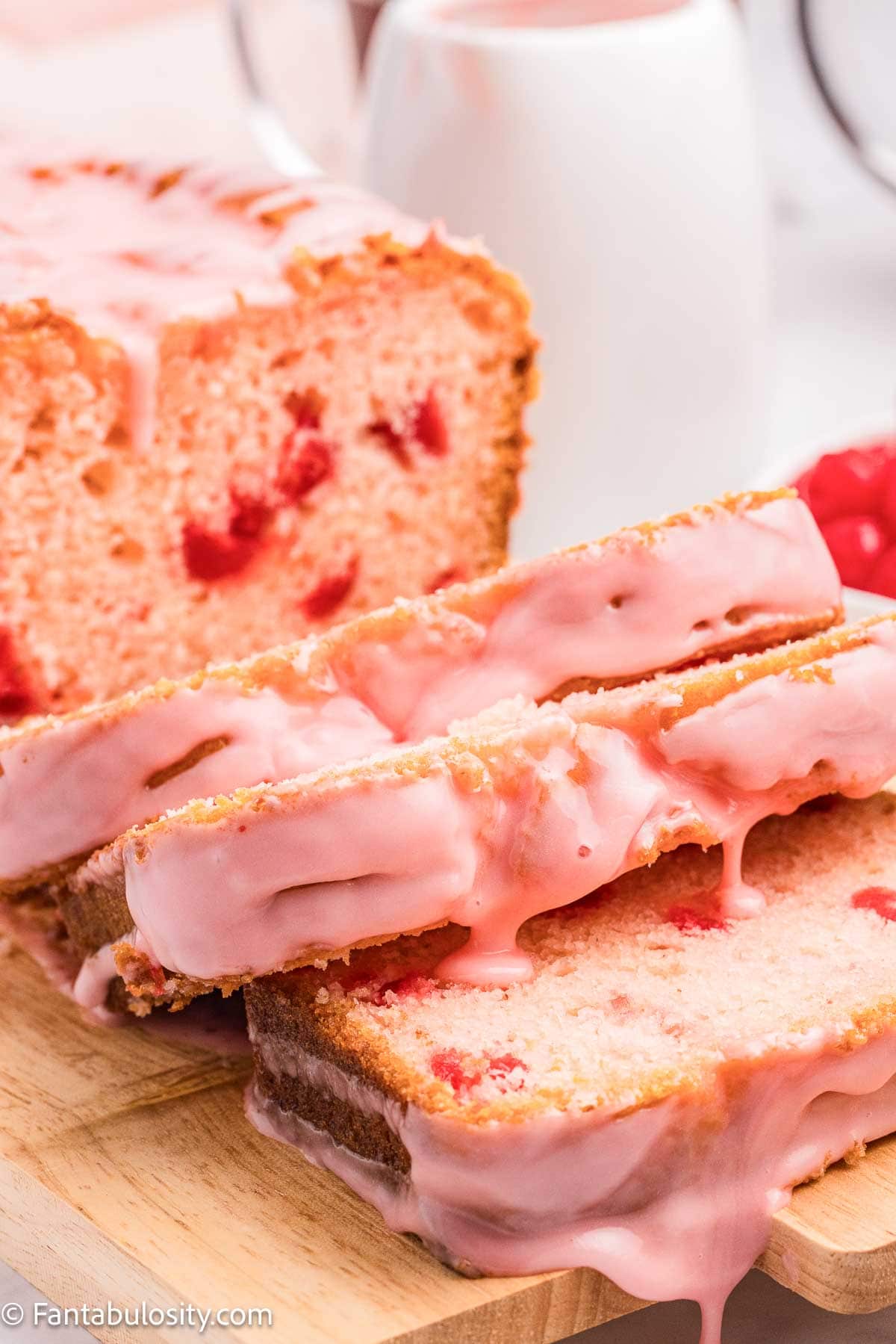 Sliced cherry bread on table.