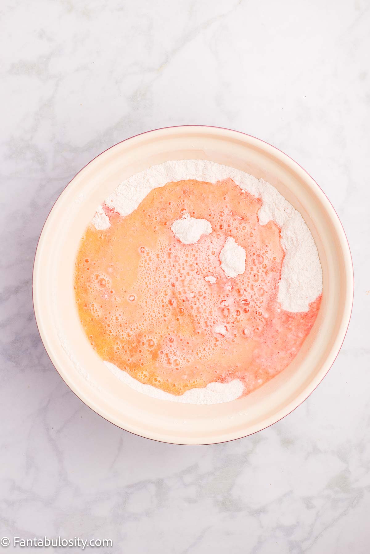 Melted butter poured on top of jello and dry ingredients mixture.