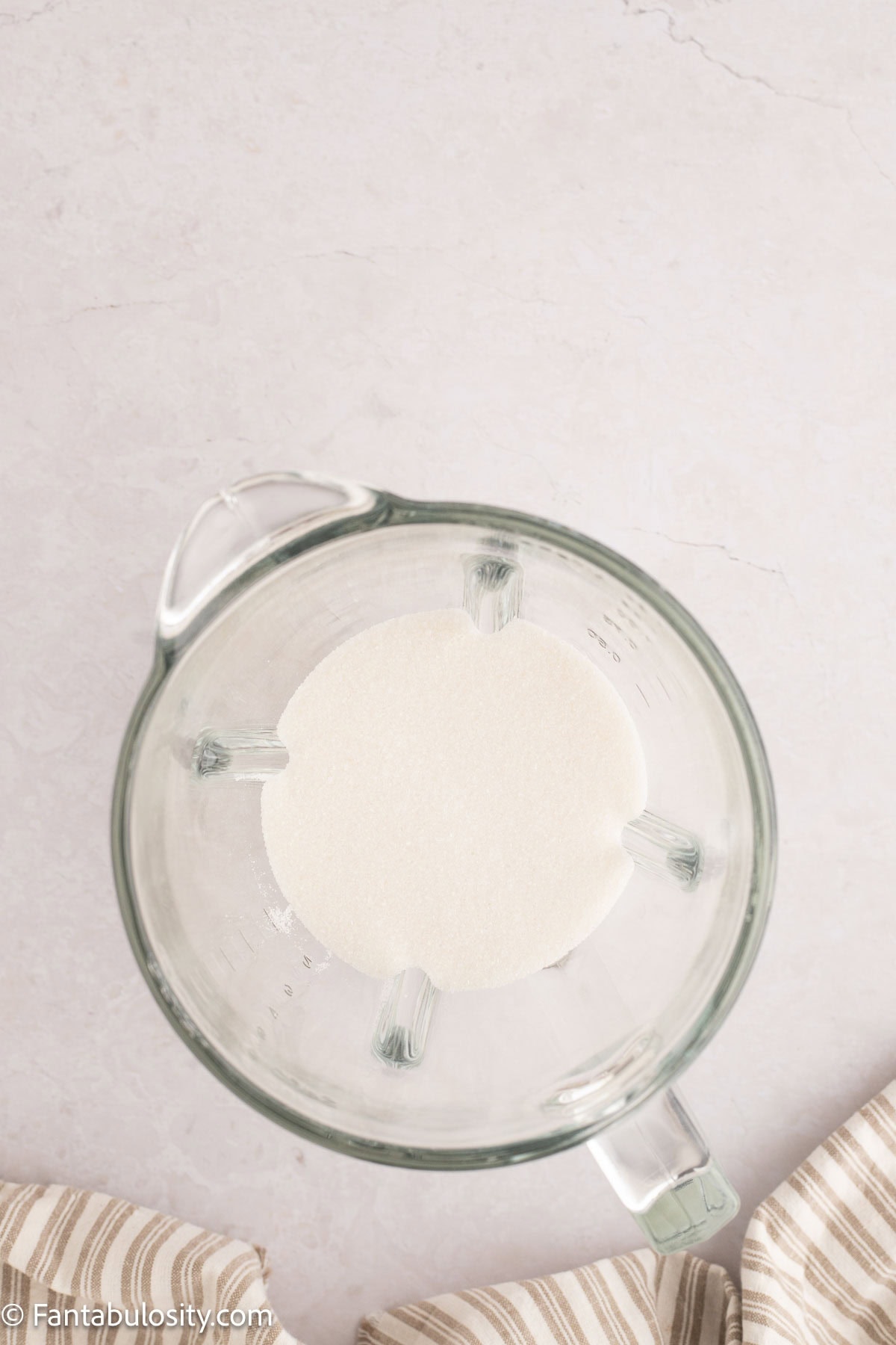 Sugar that has been put through food processor in mixing bowl.