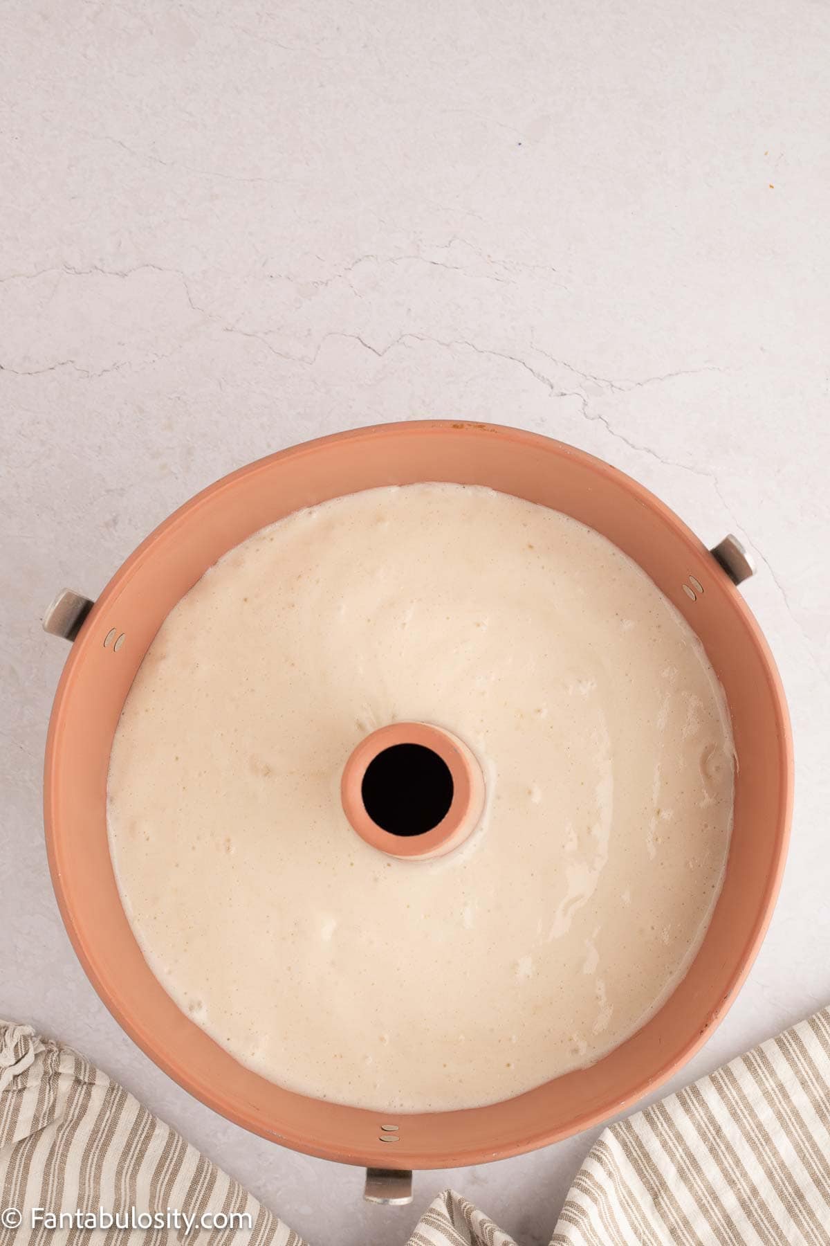 Angel food cake batter poured in to tube pan.