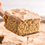 Slice of banana cake with brown butter cream cheese frosting.