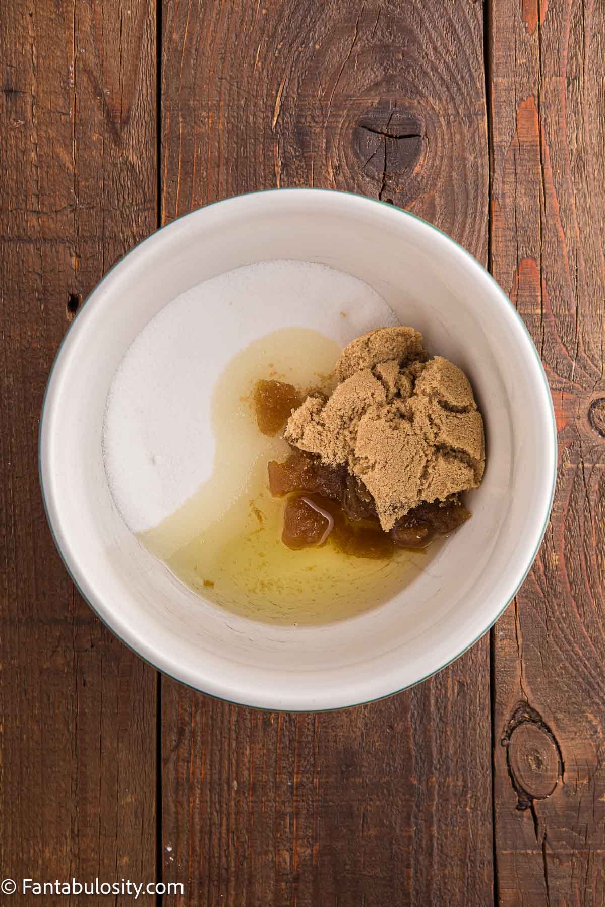 Eggs, oil and brown sugar in mixing bowl.