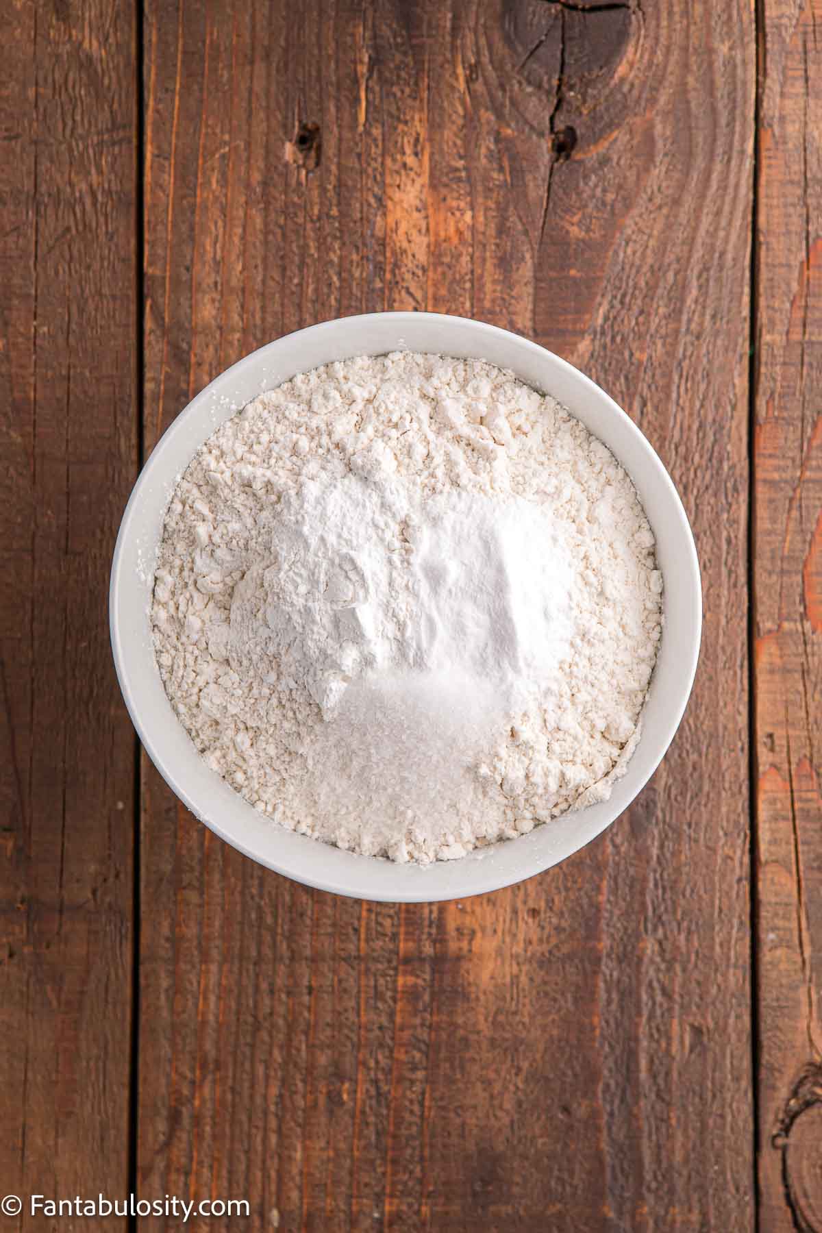 Dry ingredients such as flour and salt in mixing bowl.