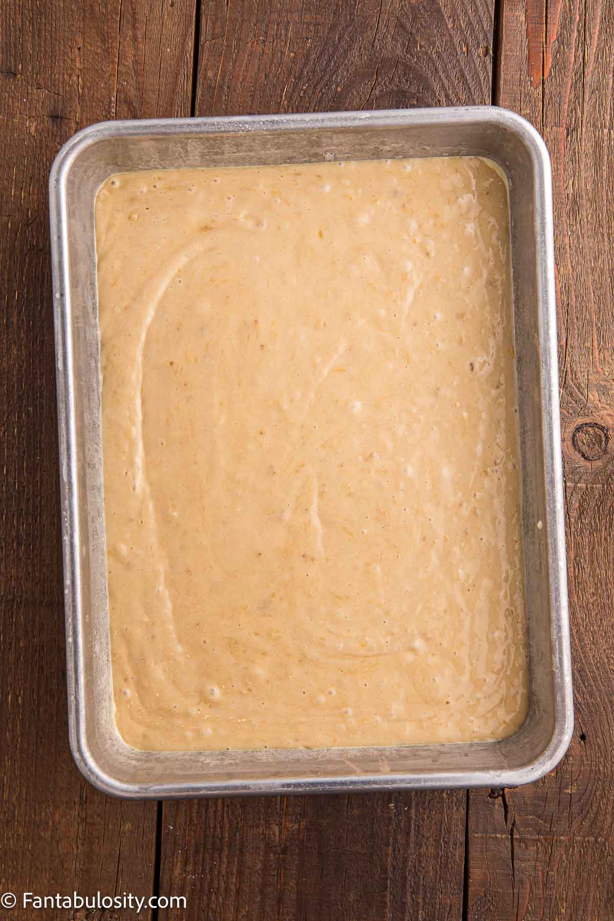 Banana cake batter poured in to 9x13 baking dish.