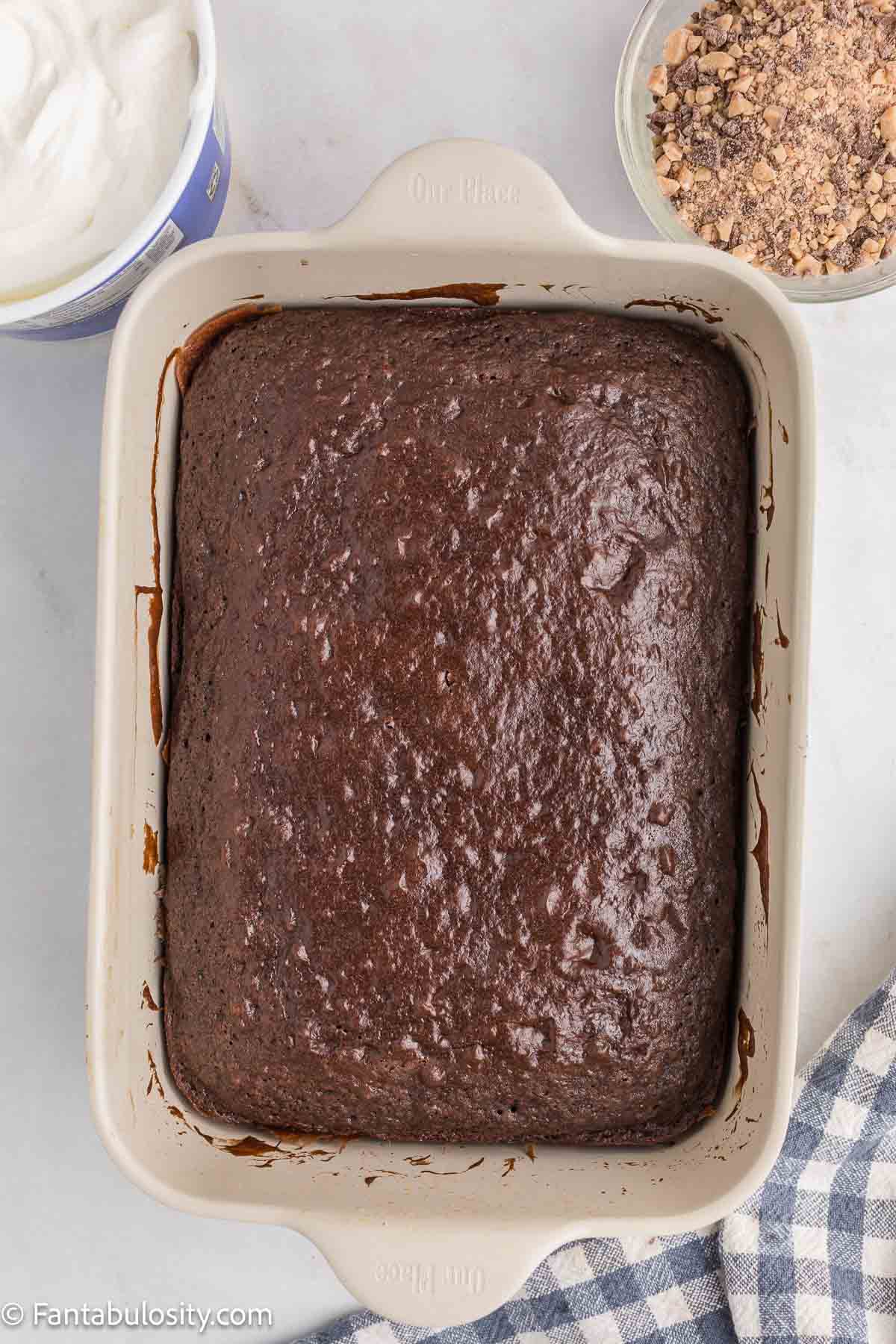 Baked chocolate cake in 9x13 baking pan.