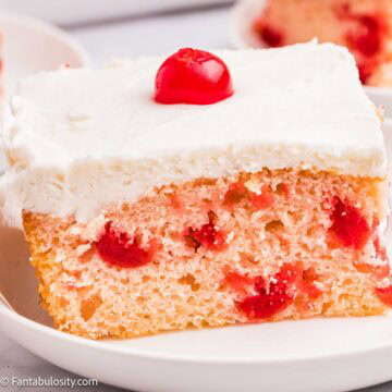 A slice of cherry sheet cake on a plate.