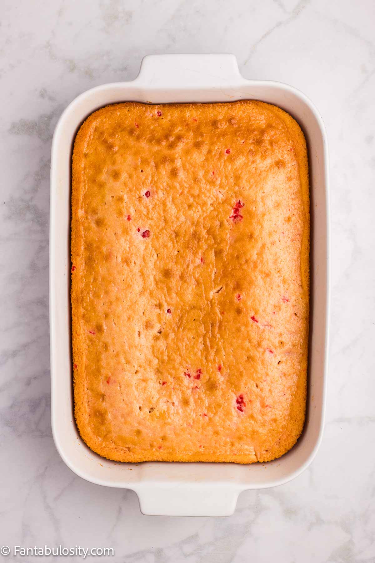 Baked cherry chip sheet cake in 9x13 baking pan.