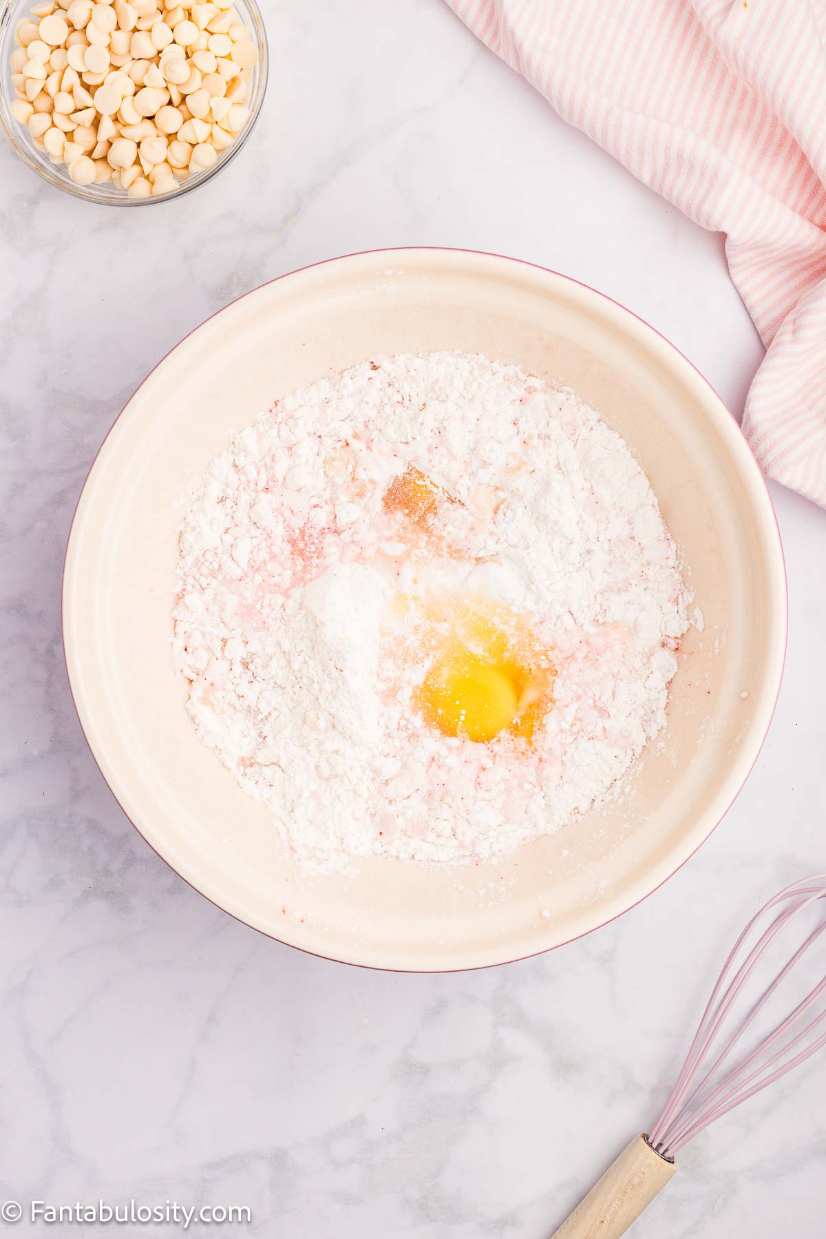 Strawberry cake mix, eggs, oil, and water in mixing bowl.