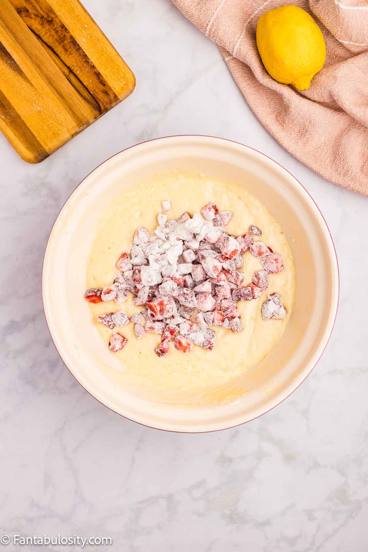 Flour coated strawberries, poured in to wet ingredients.