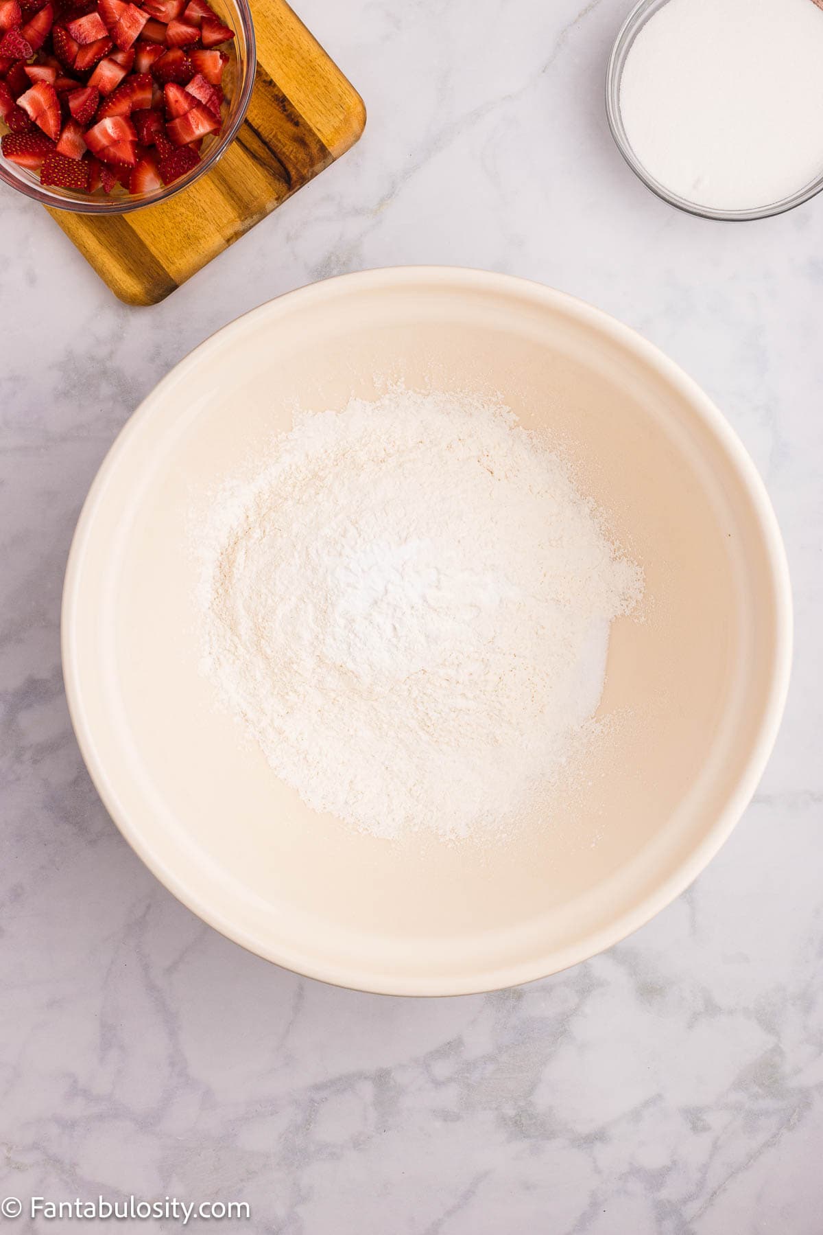 Flour, baking soda, baking powder, and salt in mixing bowl.