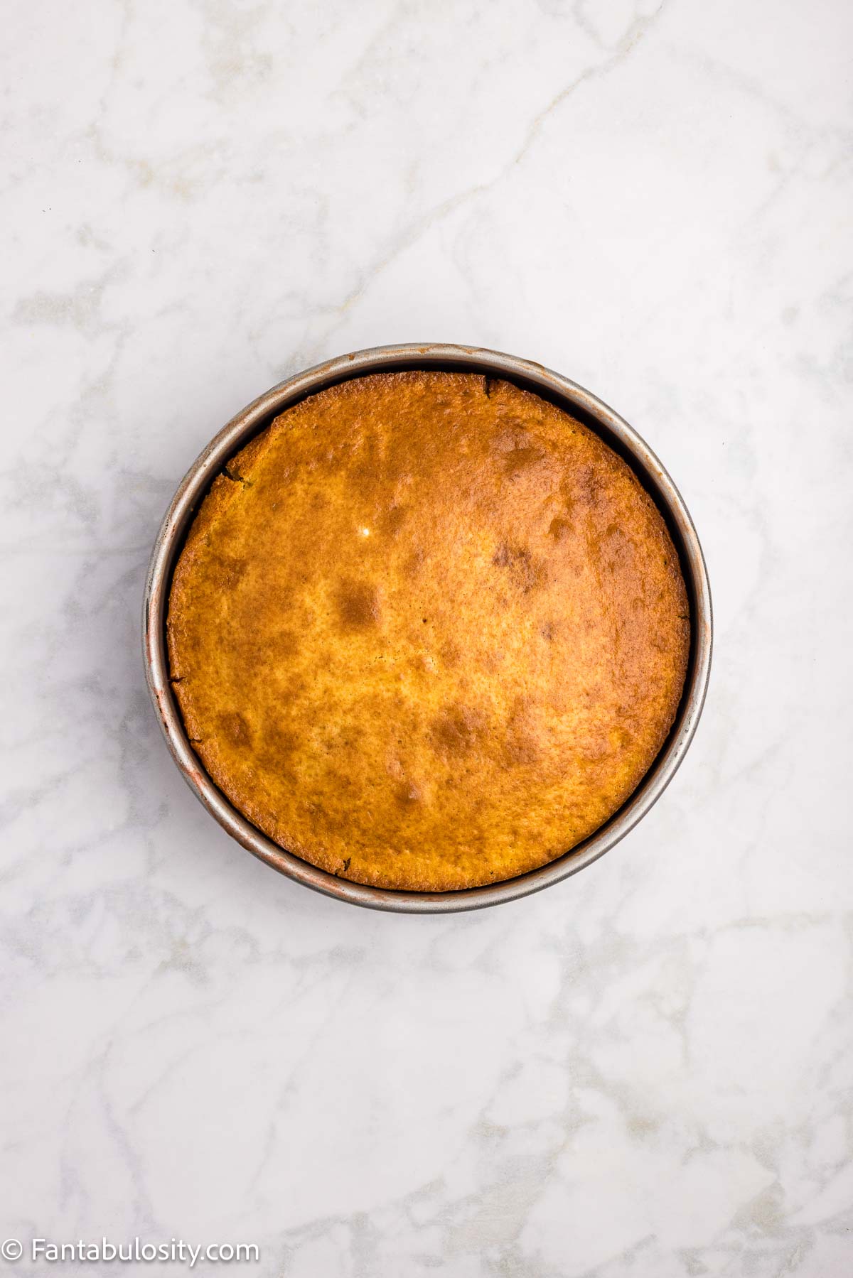 Baked strawberry upside down cake in round pan.
