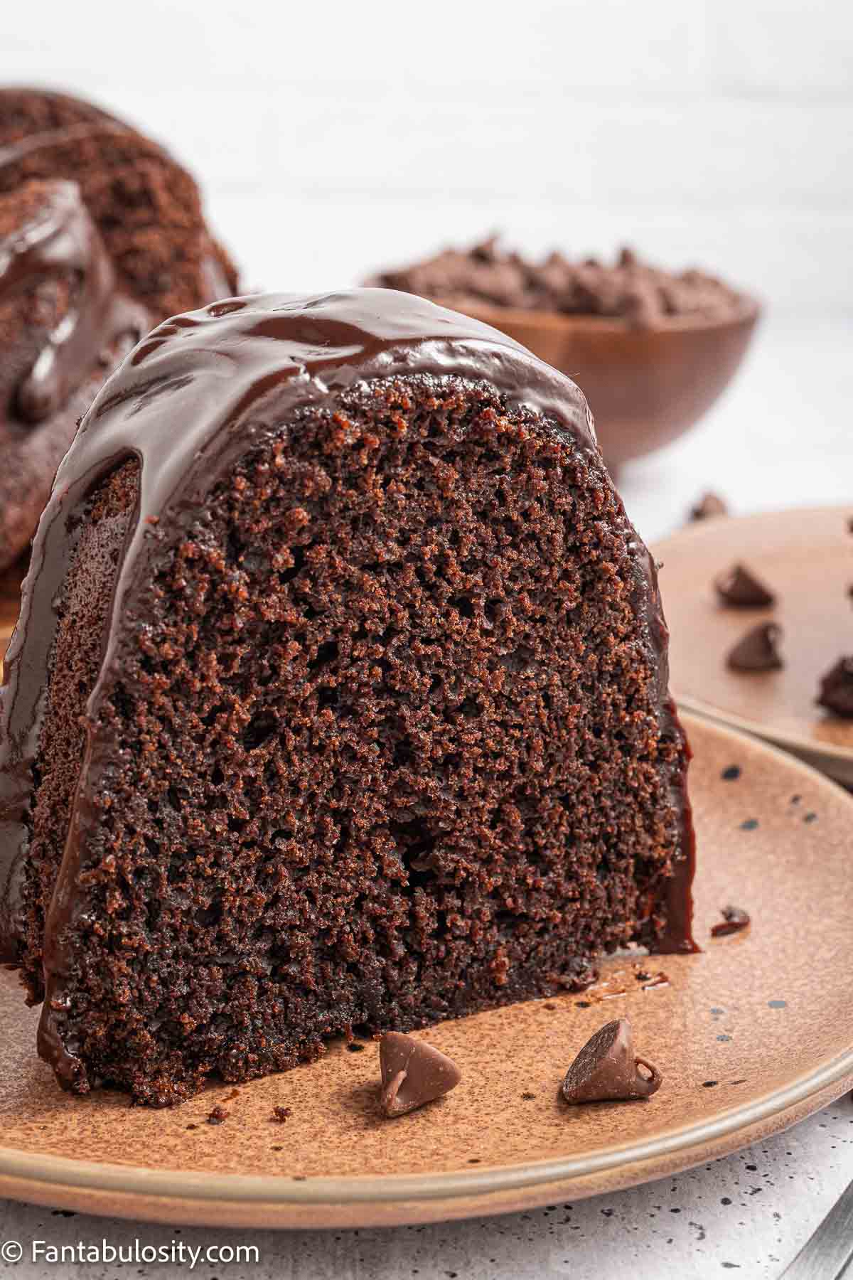 A slice of brownie cake on a plate.