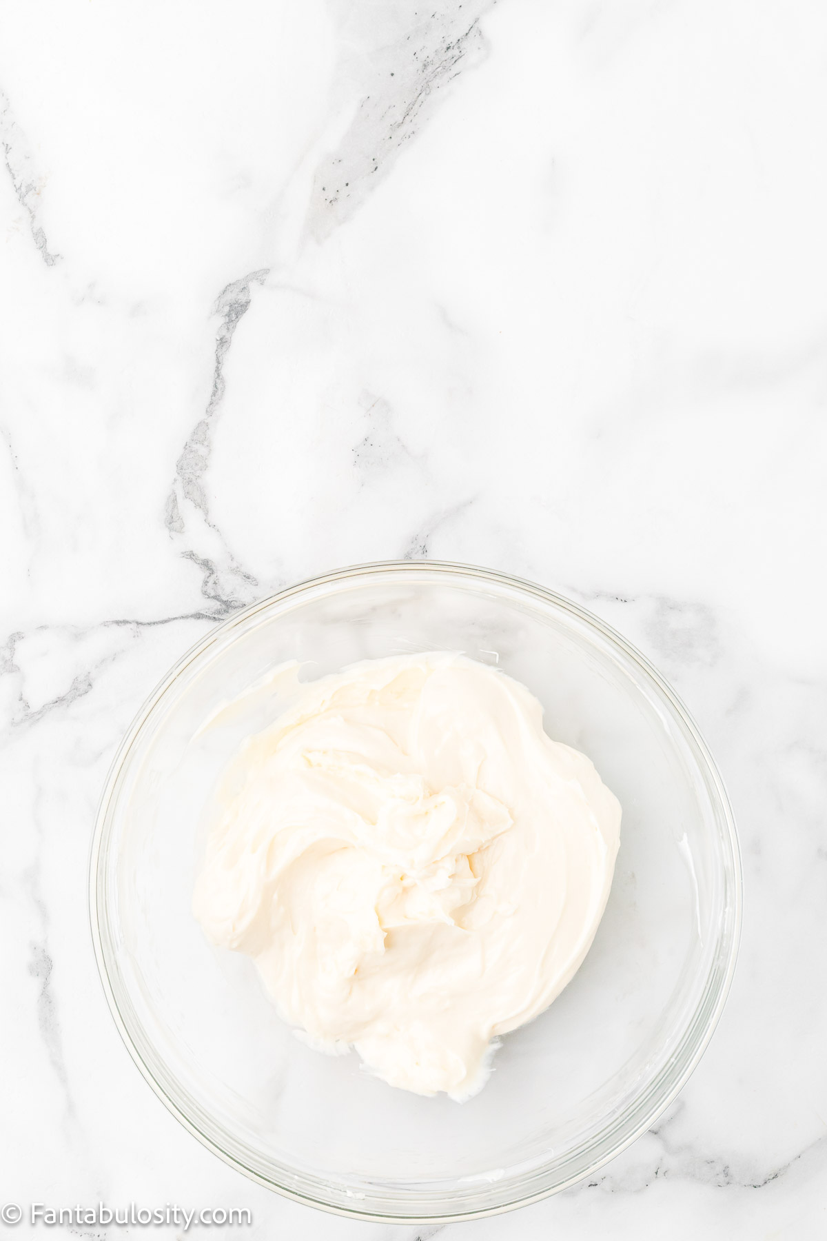 Cream cheese, sugar and vanilla beat together in mixing bowl.