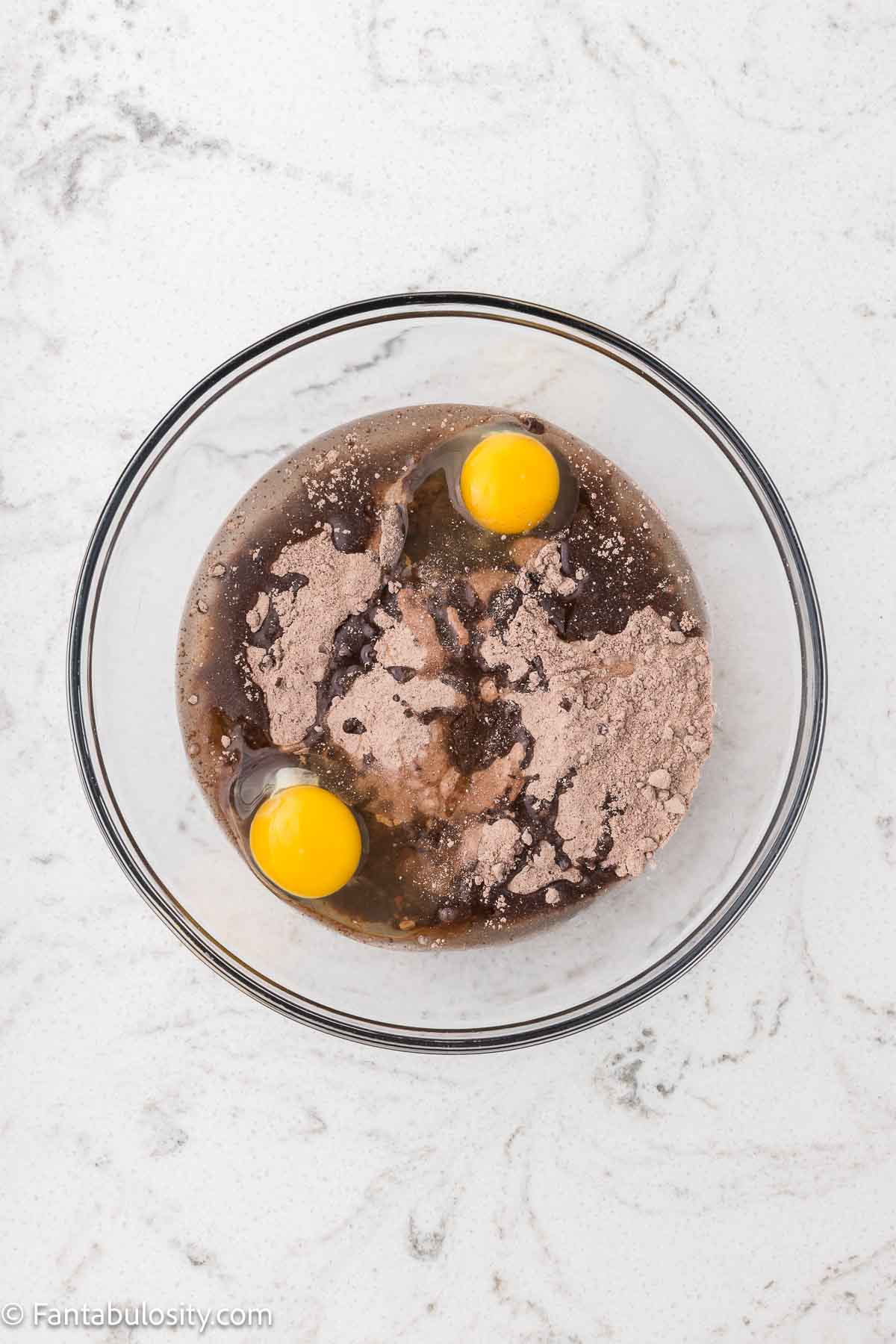 Cake mix, oil and eggs in mixing bowl.