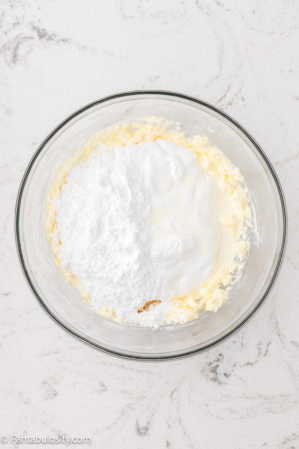 Marshmallow filling for cookies in a mixing bowl.