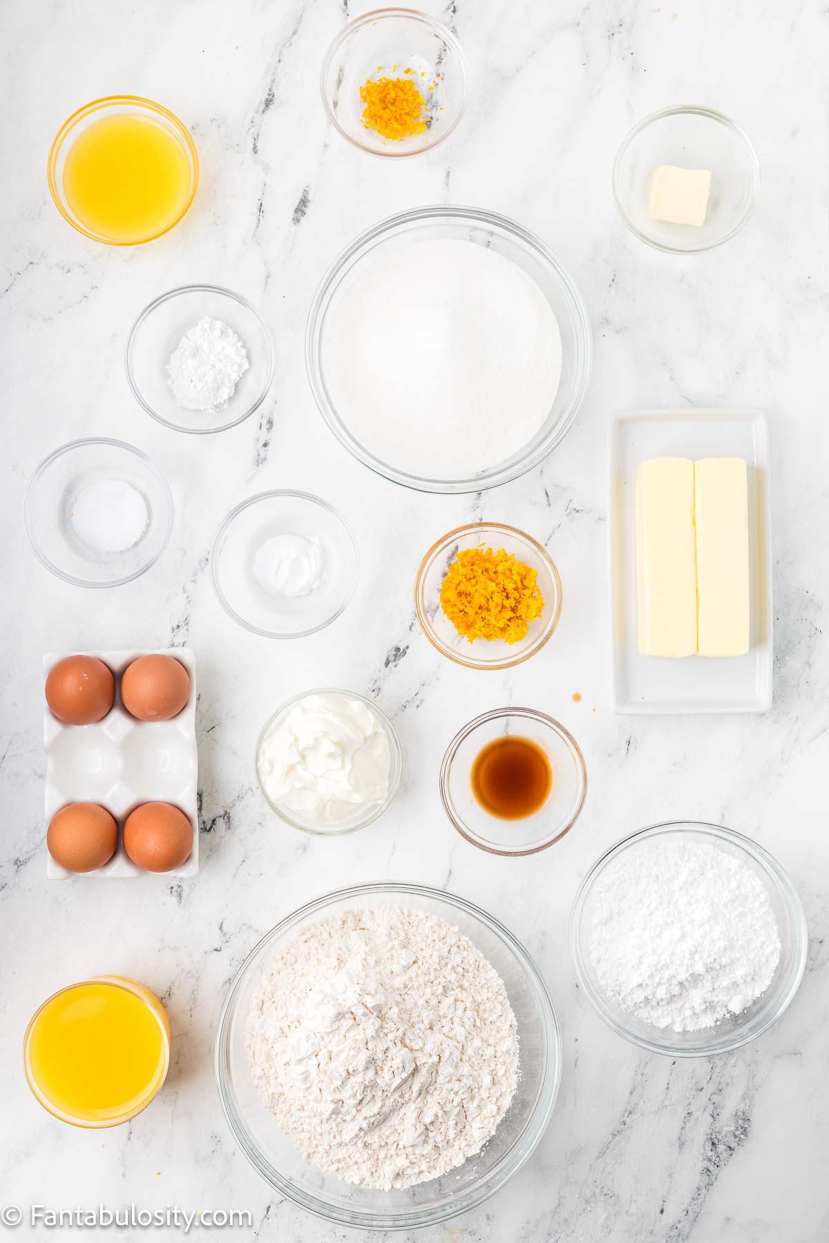 Ingredients to make orange juice cake sitting on counter.