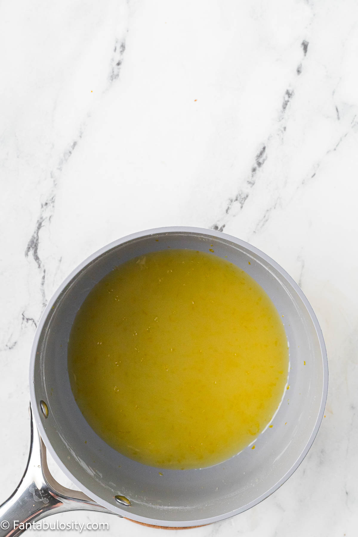 Orange glaze in sauce pan.