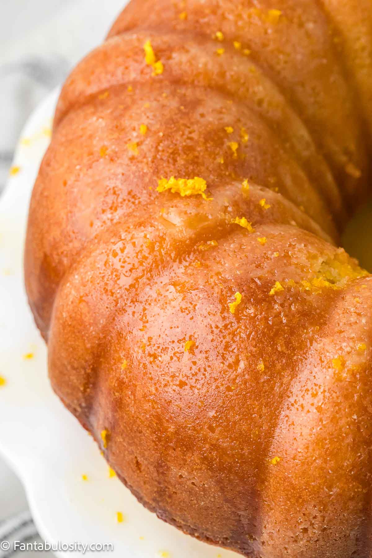Baked orange juice cake with orange zest glaze.
