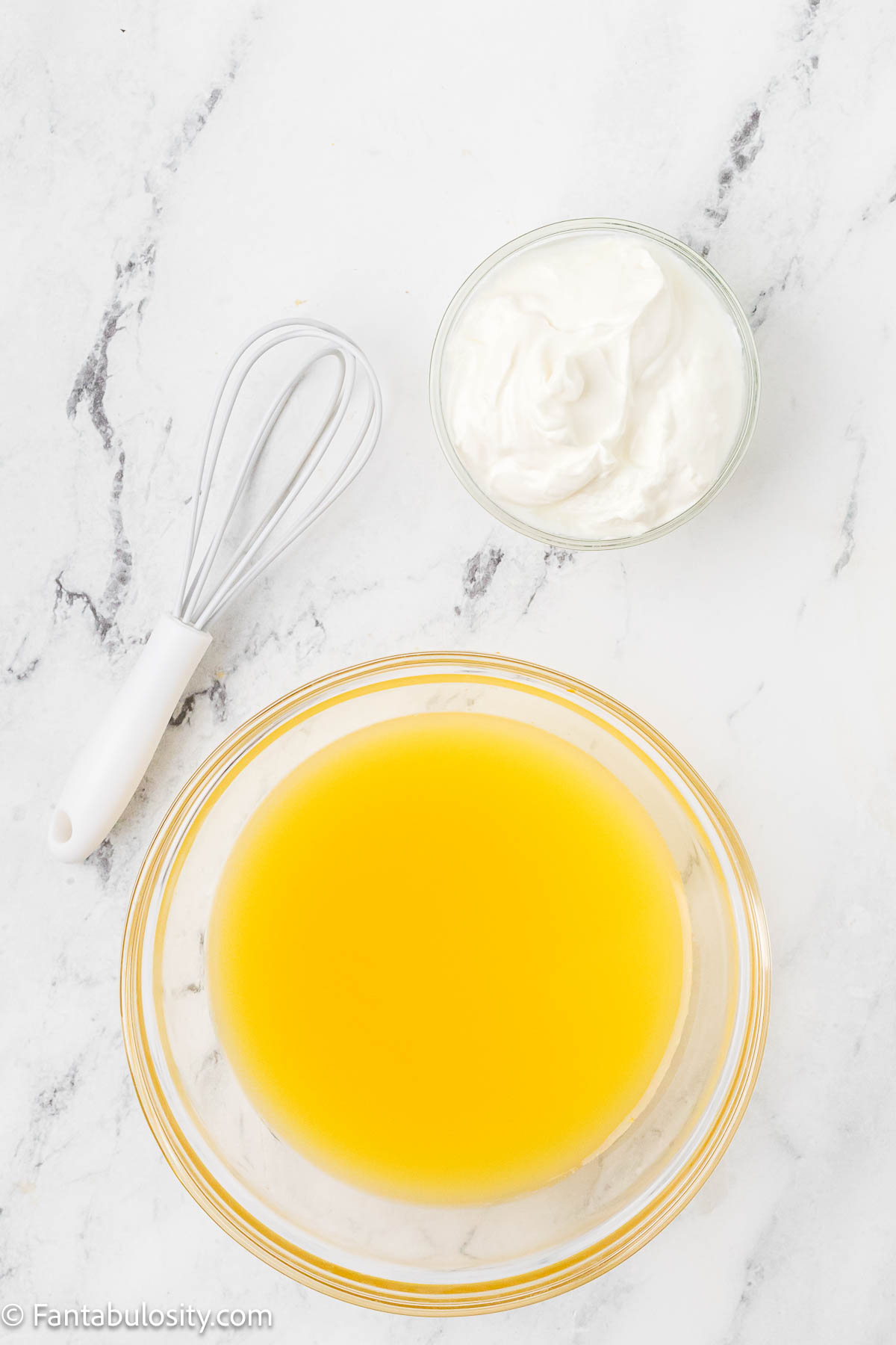 Orange juice and sour cream in bowls to mix together.