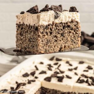 Slice of Oreo Tres Leches cake on a spatula.