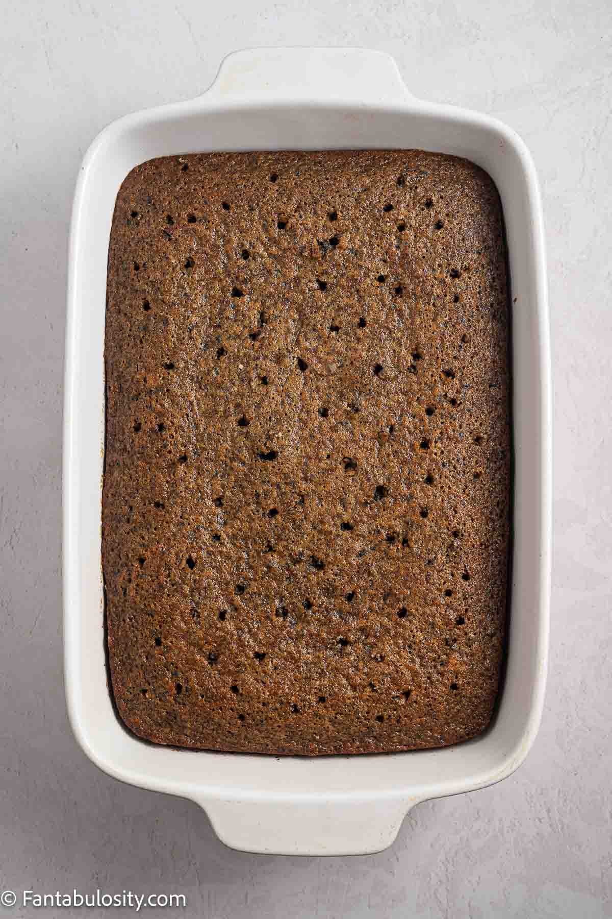 Bake Oreo cake, with holes poked in the top for milk mixture.