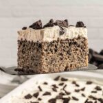 Oreo Tres Leches cake slide, on spatula.