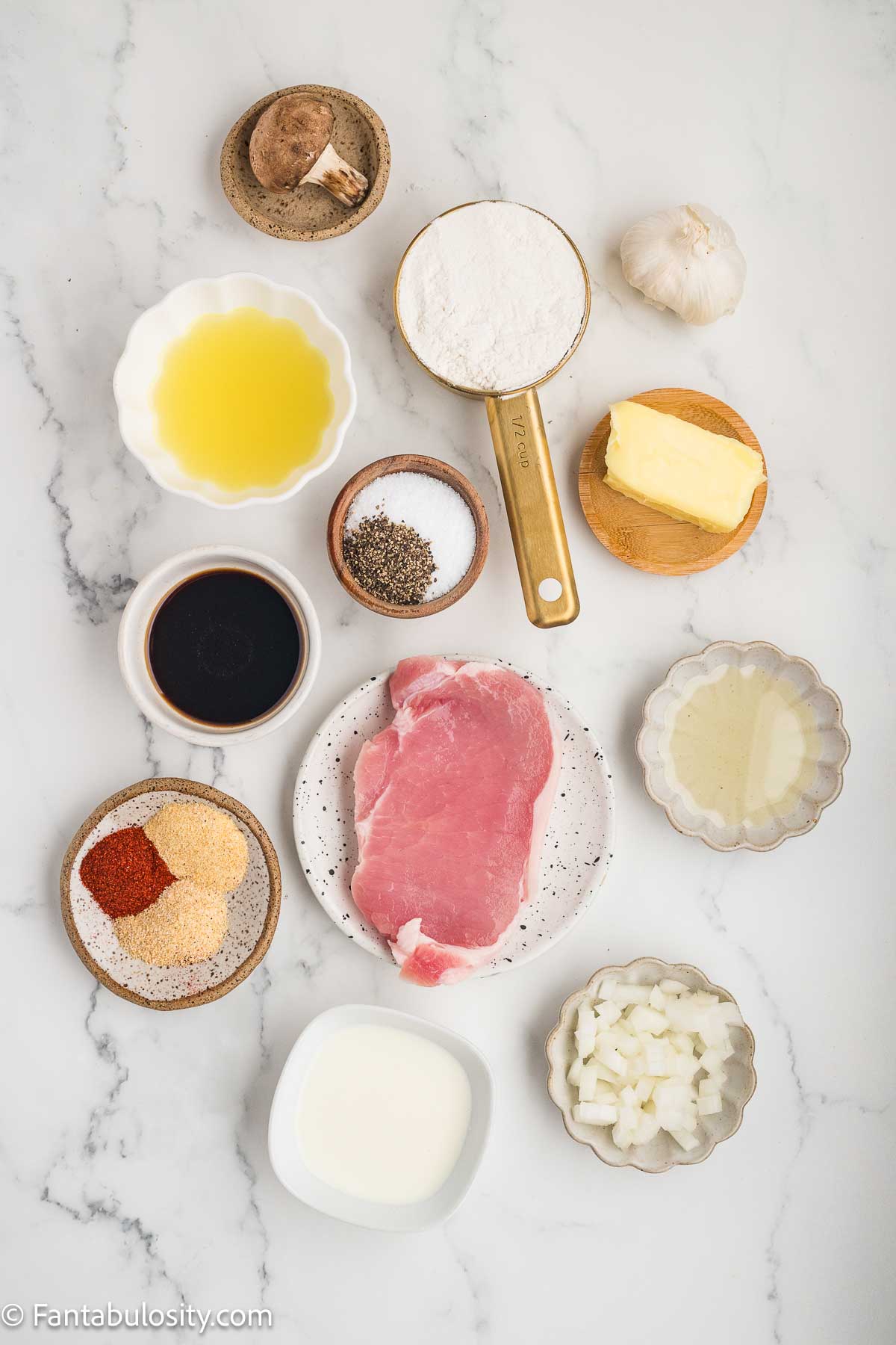 Ingredients to make smothered pork chops, sitting on kitchen counter.